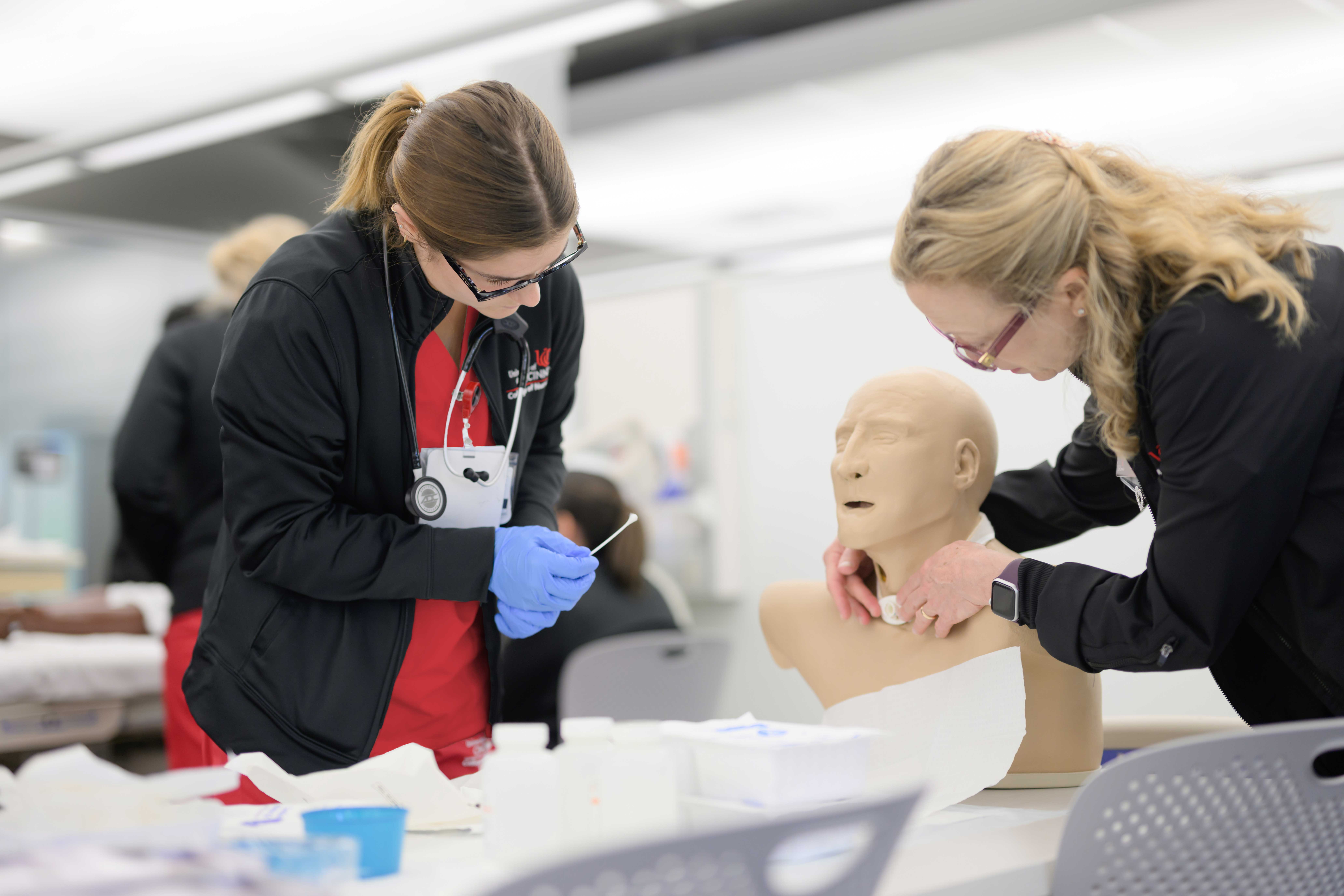 student and instructor at simulation lab