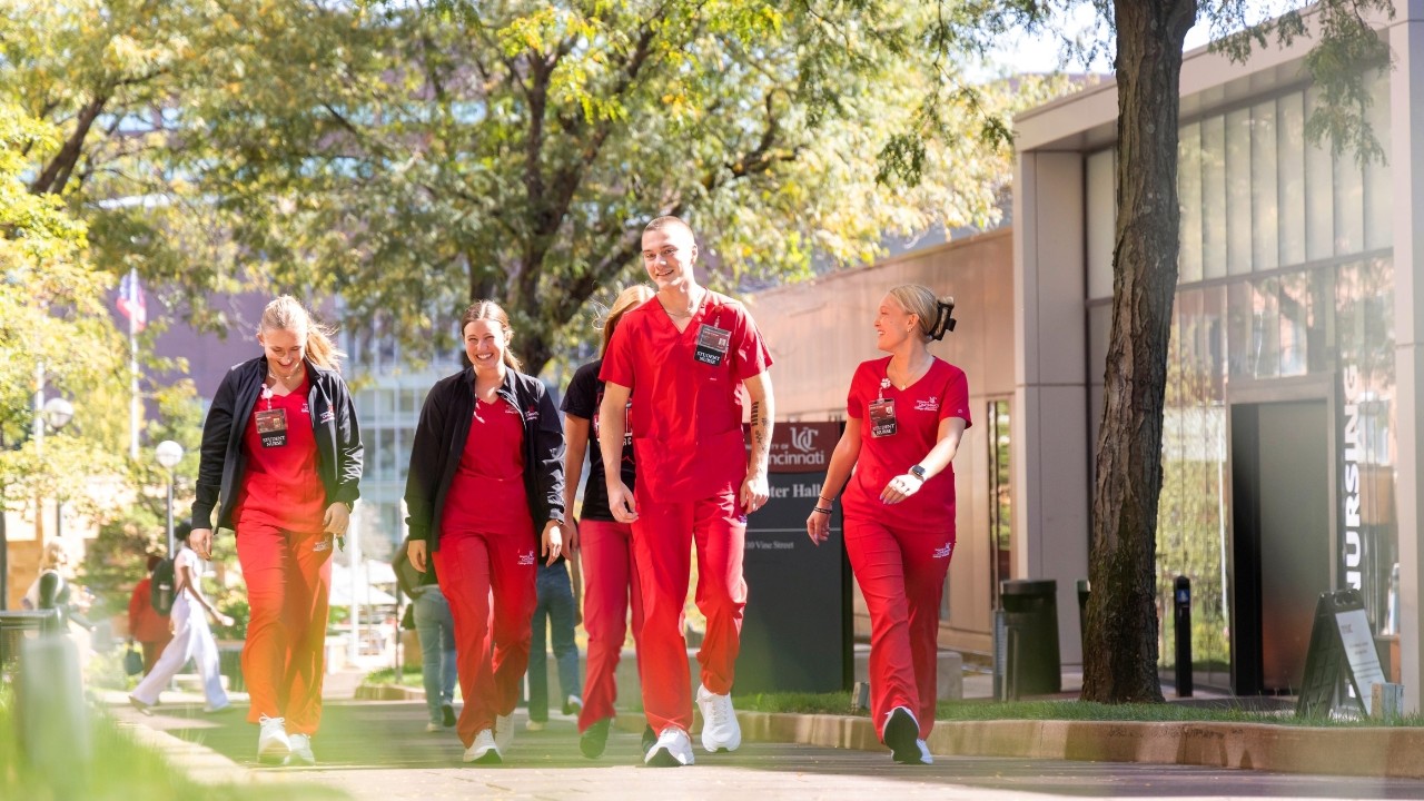 Nursing students walking in front of Procter Hall
