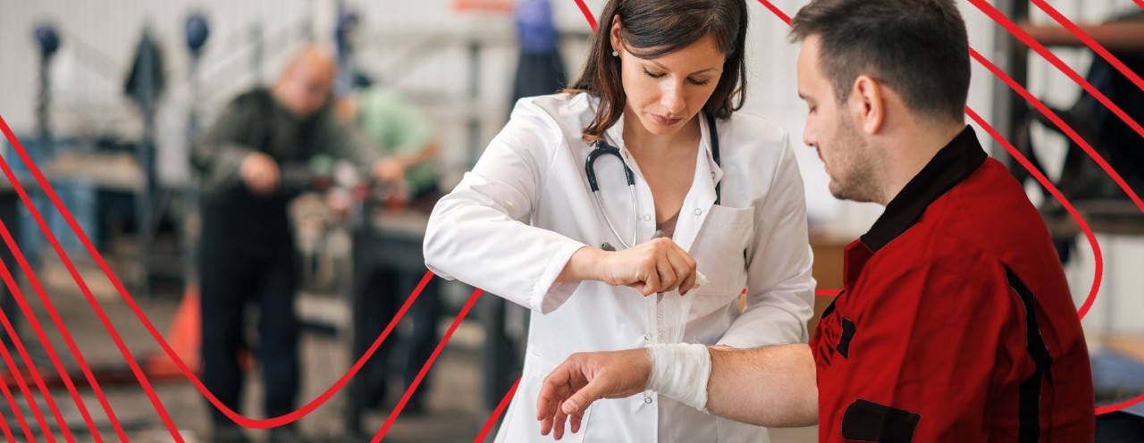 nurse wrapping worker's hand
