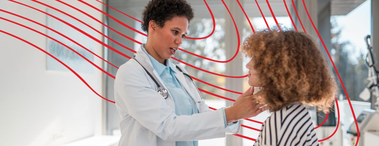 nurse examining patient in office